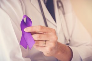 Doctor hands holding Purple ribbons, Alzheimer disease, Epilepsy